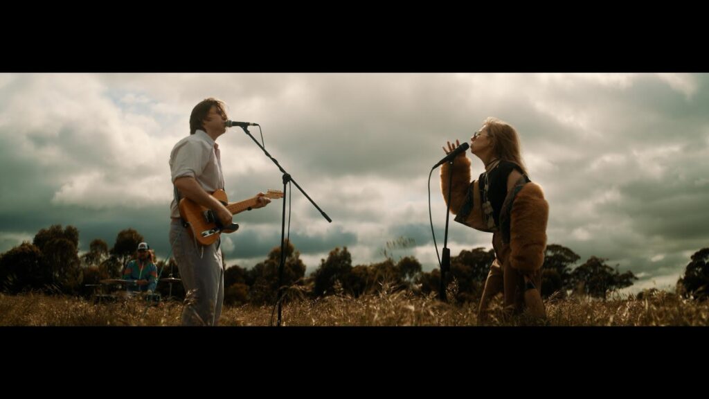 Band Members from The Sleep Ins in a field for the music clip for God Damn It, my friend.